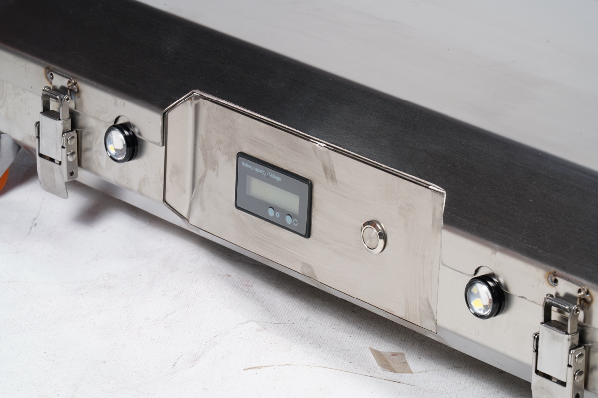 Shenghe AGV stainless steel control panel — digital battery display, indicator LEDs, power button. Built and tested in Cixi factory.