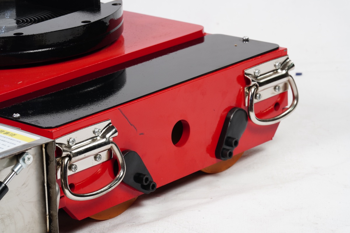 Side handle and chassis frame detail showing stainless steel construction and rubber bumper